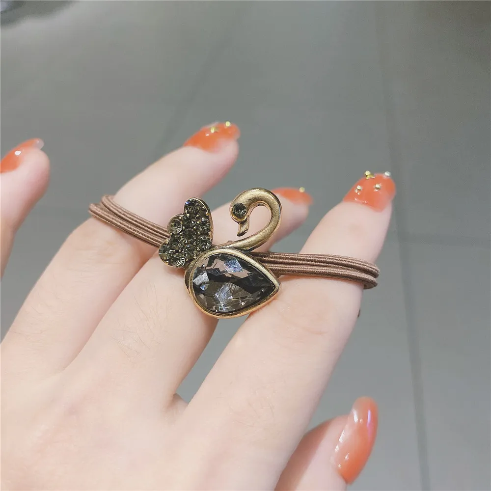 

High-end retro crystal four-leaf clover hair tie new full diamond hair rope fashion net red head rope female simple temperament