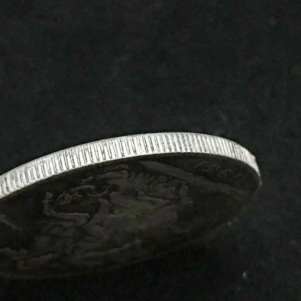 Коллекционные монеты из серебра и золота с изображением дракона в стиле Святого