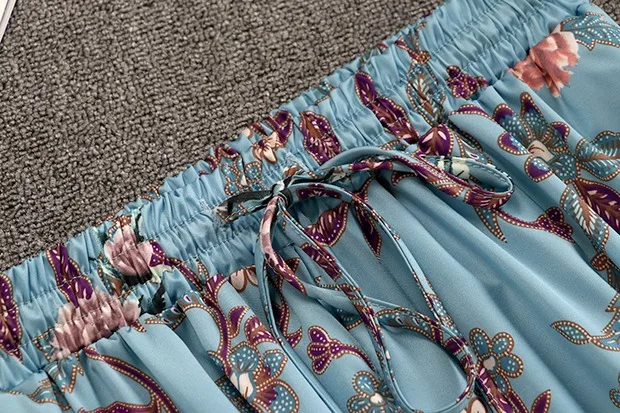 

Summer Elegant Glossy Solid O Neck Satin Tee + Elastic Waist Floral Print Wide leg Split Pant Set Ladies Two Piece Trousers Suit