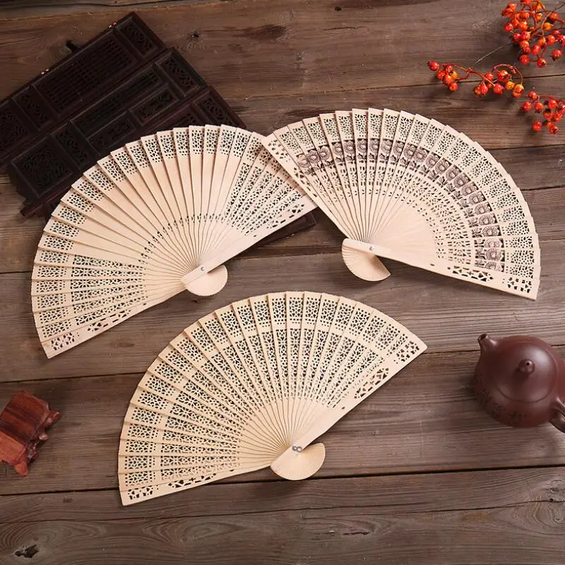 

Sandalwood Fan Hand Held Folding Fans Chinese Traditional Hollow Fans Wooden Baby Shower Gifts Wedding Favors LX7555