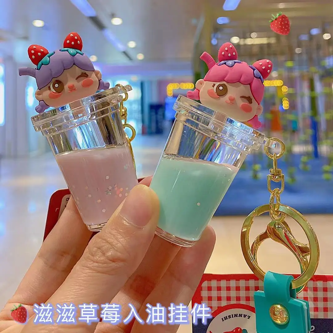 

Creative Liquid Quicksand Floating Girl Keyring Cute Strawberry Girl Keychain Keychain Perfume Bottle Bag Key Chains Gifts