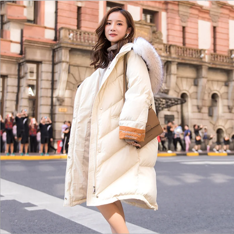 Женский длинный пуховик с воротником-стойкой однотонный теплый свободный из