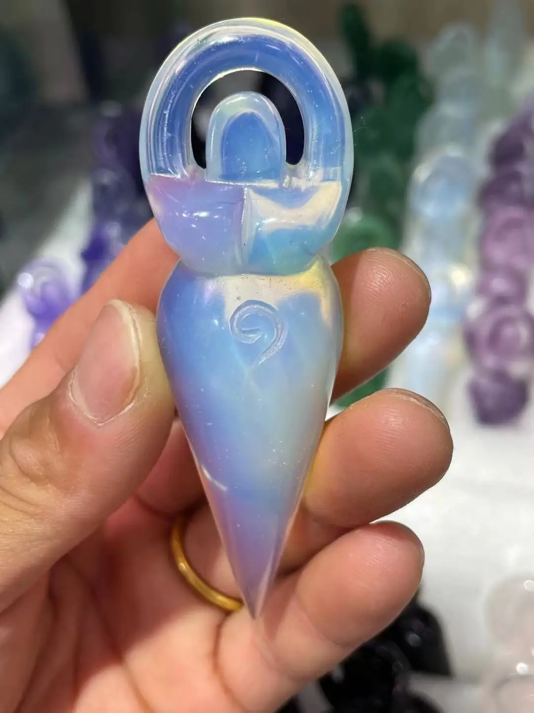 

Natural hand carved opinite mineral crystal figurine pendant