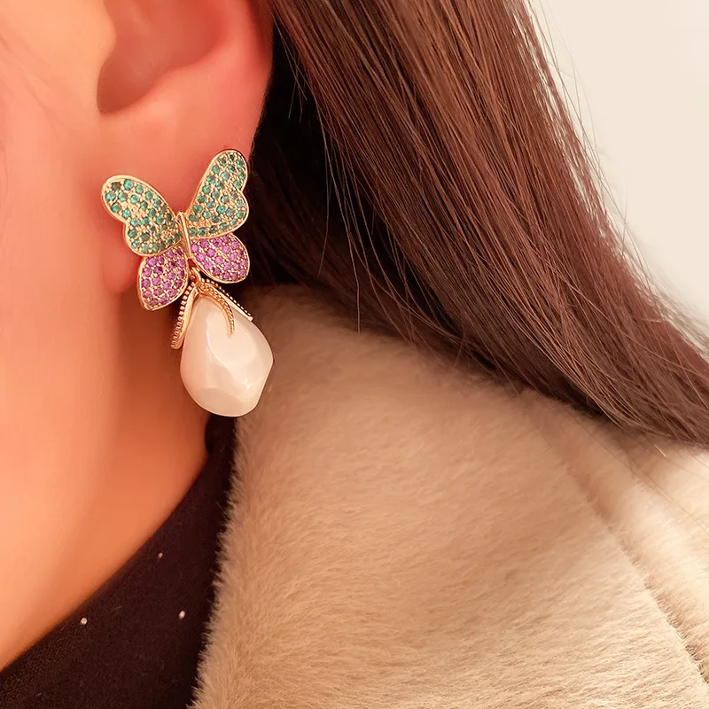 

Color butterfly irregular pearl earrings female 925 silver earrings temperament online celebrity earrings