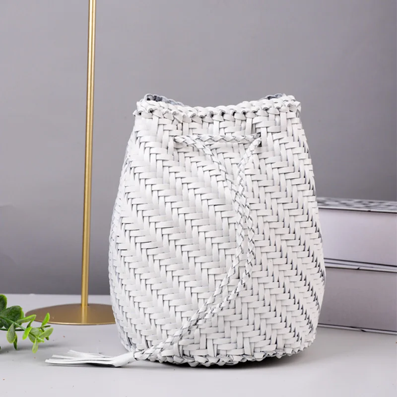 

French style leather bag with artistic head and one shoulder slanting bucket