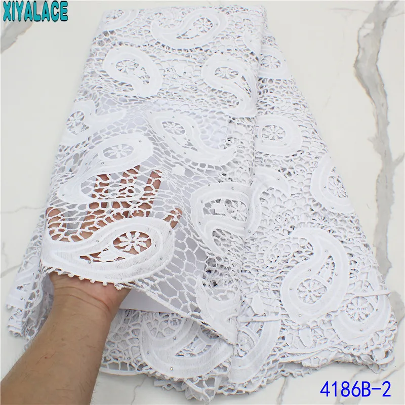 

Latest Cord Fabrics High Quality Guipure Cord Lace Milk Silk Lace Water Soluble Lace with Stones for Wedding Dress KS4186B