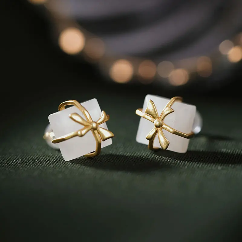 

Silver inlaid natural Hotan white jade Bow Earrings Chinese style retro unique charm Christmas and Halloween magic gift
