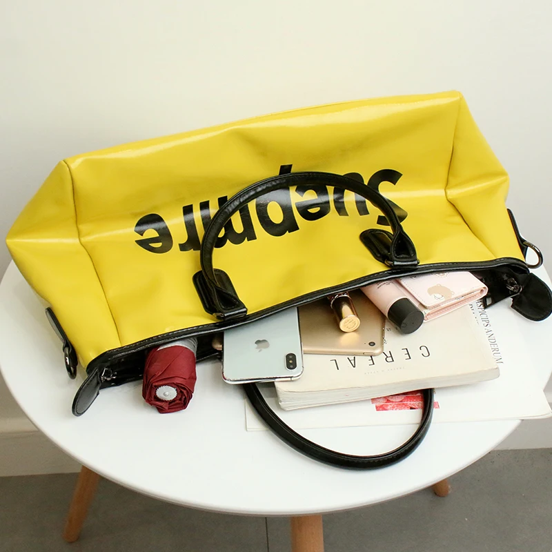 

YILIAN Handheld travel bag women 2021 new splicing fashion simple duffel bag large capacity business travel boarding package