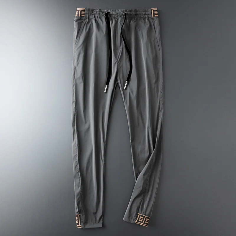 

2021 Mens Luxury Jogger Pants New Brand Drawstring Sports Pant Men Stitching Thin Section Ribbon Personality Casual Trousers