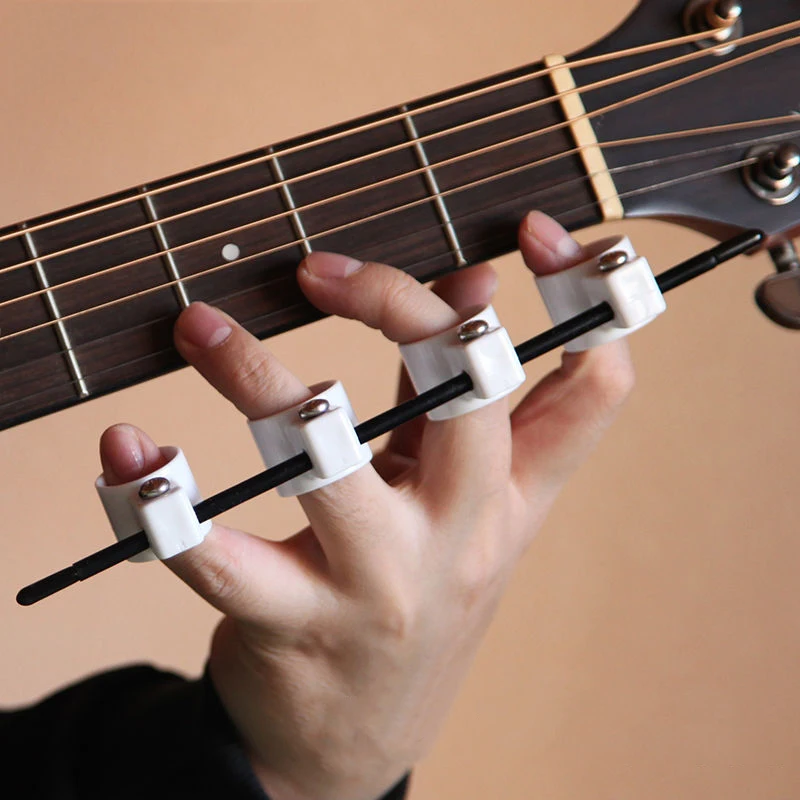 

Guitar Trainer Tool Acoustic Guitar Finger Expansion Sleeves Finger Force Ukulele Piano Span Practice Tool Accessories E