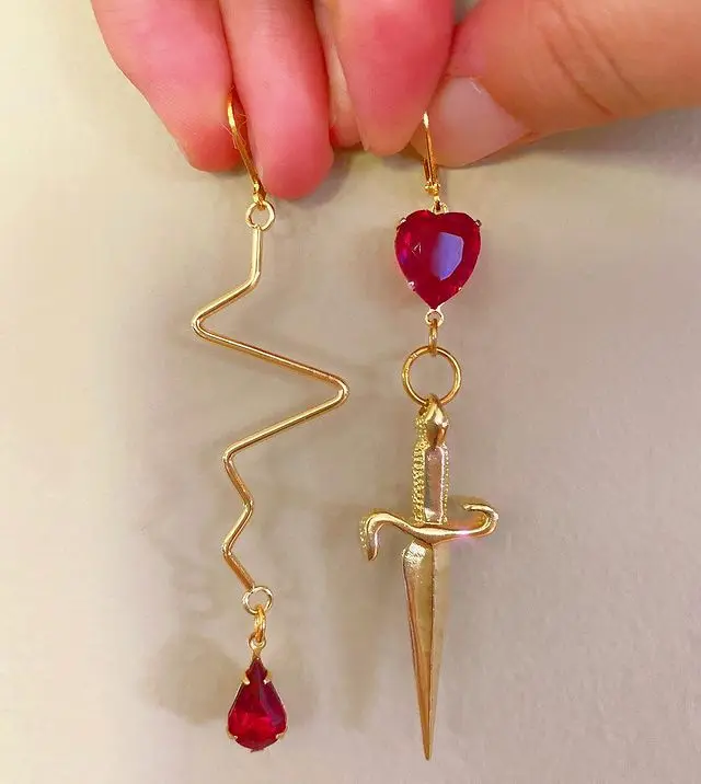 

The Gold Plated Sword Red Heart Gem Statement Earrings