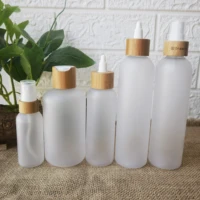 wholesale frosted plastic spray cleanse bottle empty cosmetic packaging container water bottles cream jar wtih bamboo lid