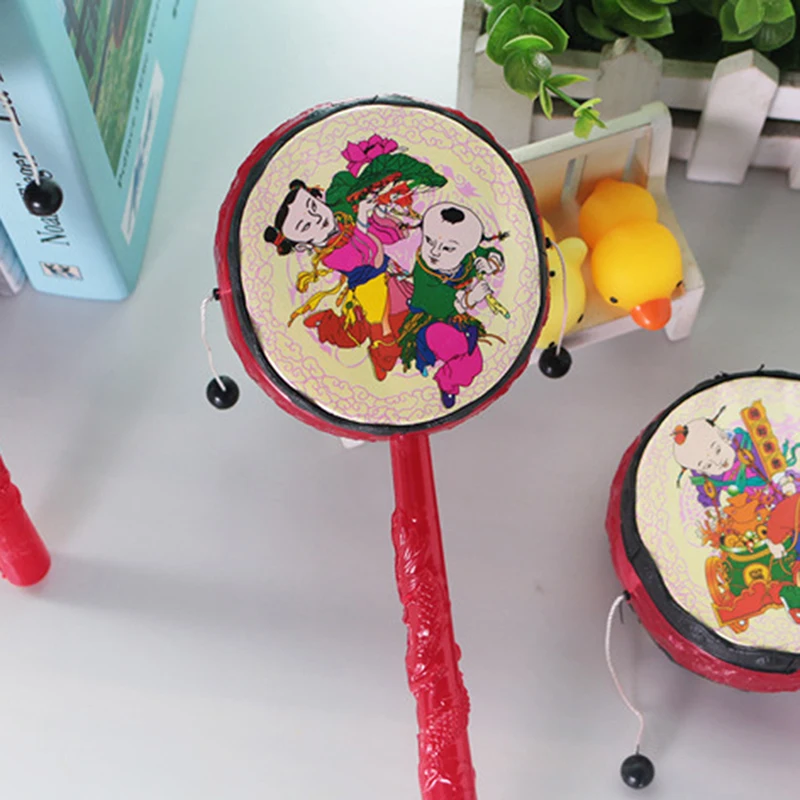 

Red Chinese Traditional Spin Toy Rattle Drum Kids Cartoon Hand Bell Plastic For Baby