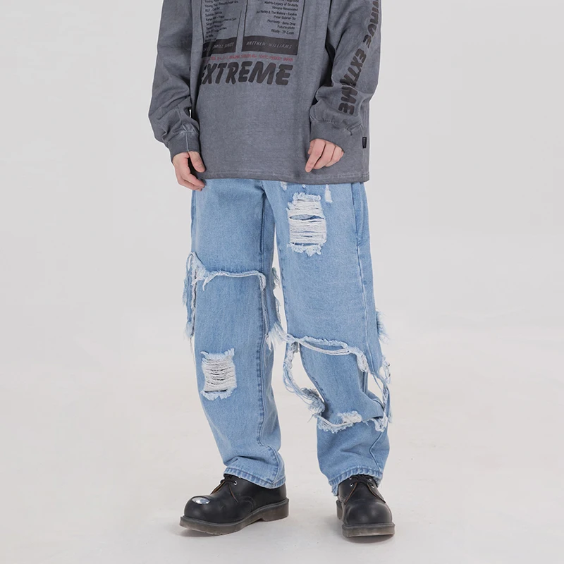 Рваные джинсы с асимметричными дырками широкими штанинами для мужчин и женщин