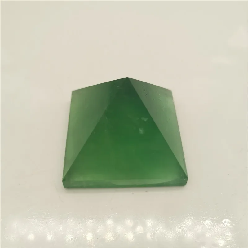 

The natural green fluorite pyramid is a meditation town The first choice for home decoration