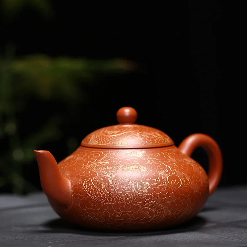

Red clay teapot with dragon pattern and pear shaped vase
