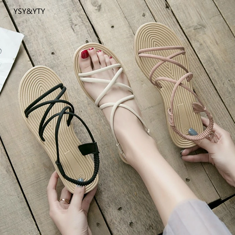 

2019 new sandals female summer flat open toe students Korean version of the wild seaside holiday Rome beach shoes fairy shoes