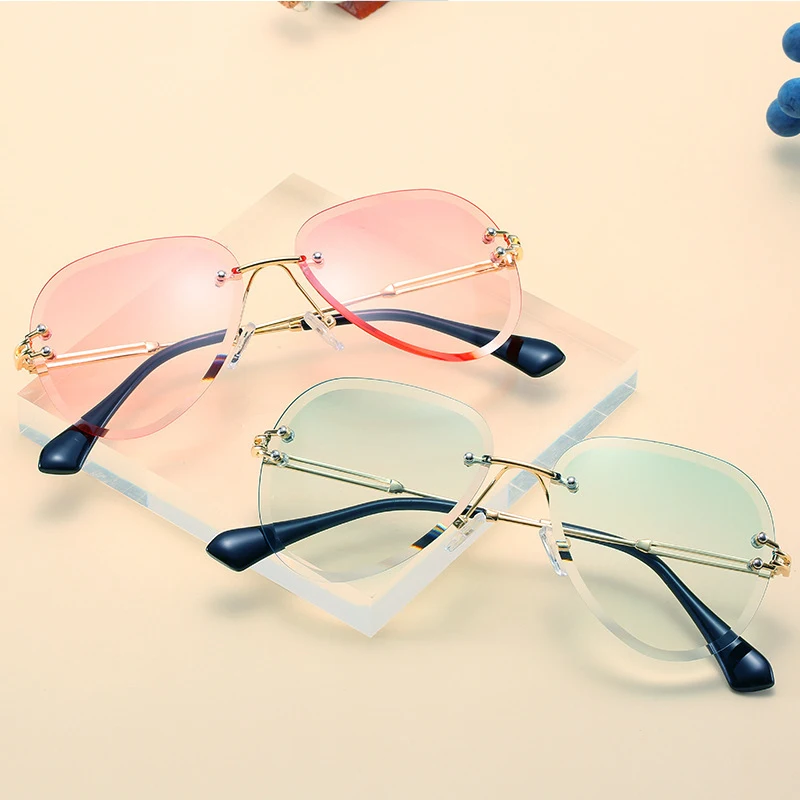 

Ladies Rimless Sunglasses Unique Cut Edge Design Glasses Men's Sunshade Outdoor Glasses Ladies Luxury Fashion Sunglasses