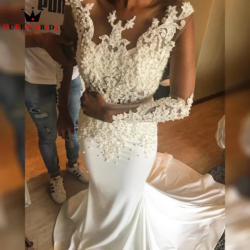 Свадебное платье с длинным рукавом юбкой годе бисером и жемчугом |