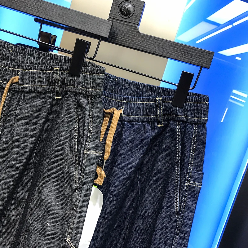 

2020 men's autumn new elastic versatile fashion pocket letter offset binding waist casual handsome personality jeans trendy man