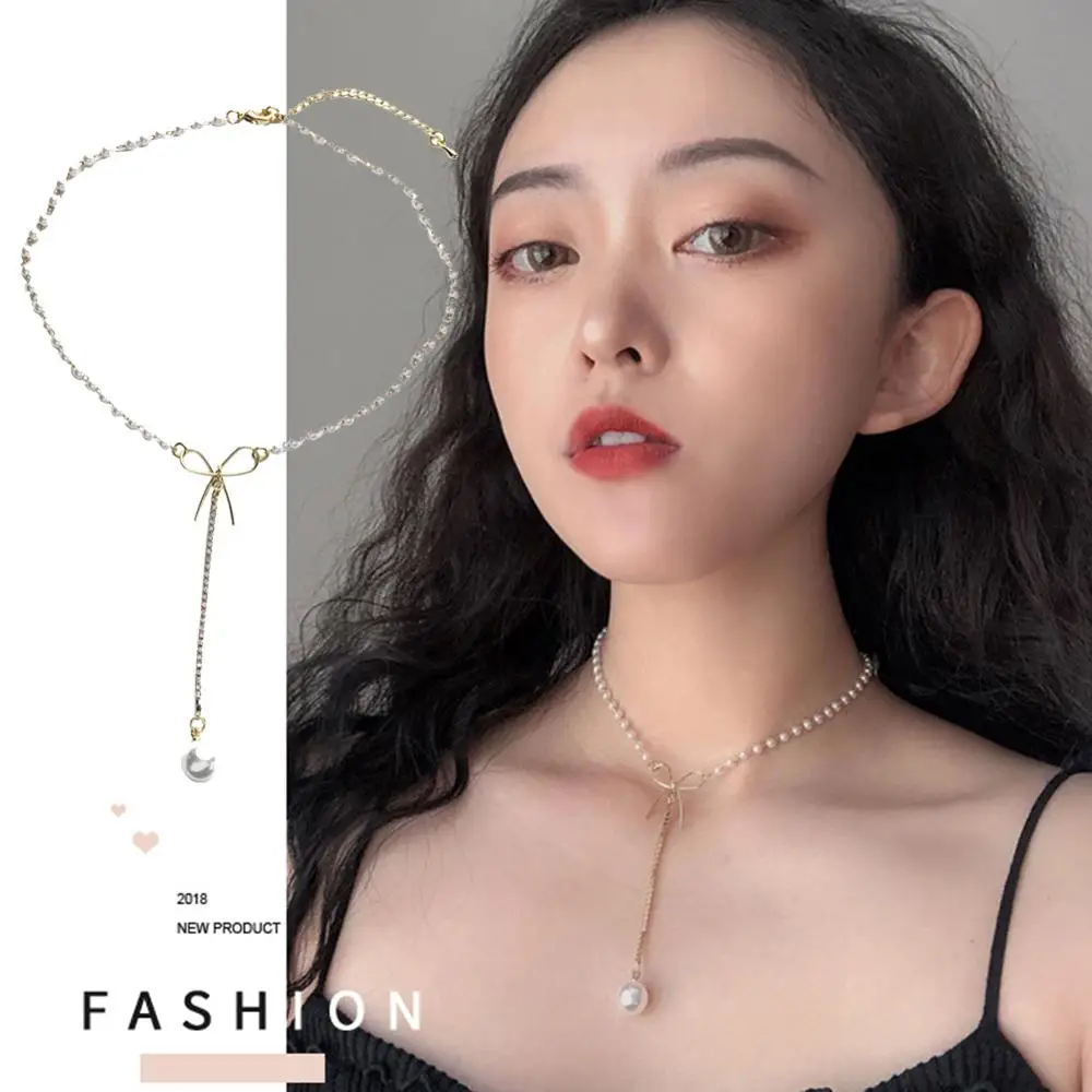 Элегантное модное ожерелье на длинной цепочке с жемчугом и бантом. Простая мерцание циркона.