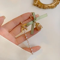 s925 needle new asymmetrical green bow earrings hot sale golden color bird small beads drop earrings for women party gifts