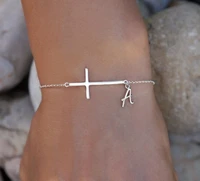 sideways cross bracelet with dainty initial initial bracelet in silver plated