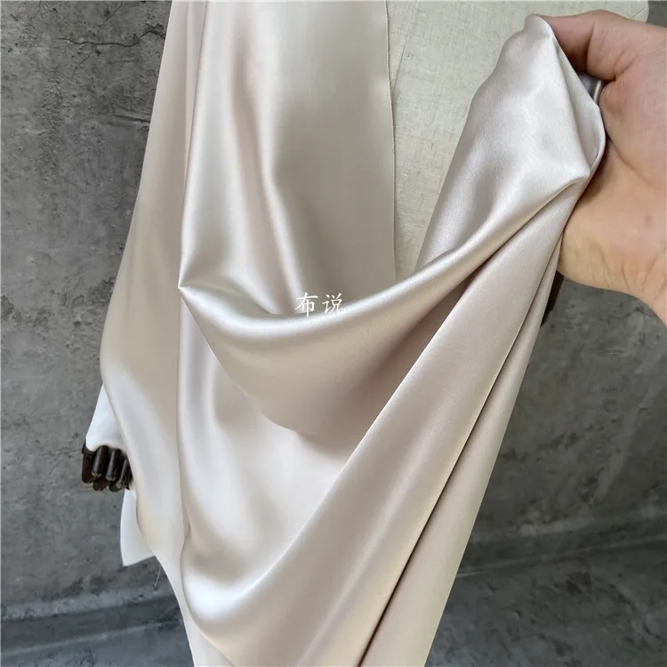 Ацетатная атласная ткань цвета шампанского и бежевого гладкая блестящая для