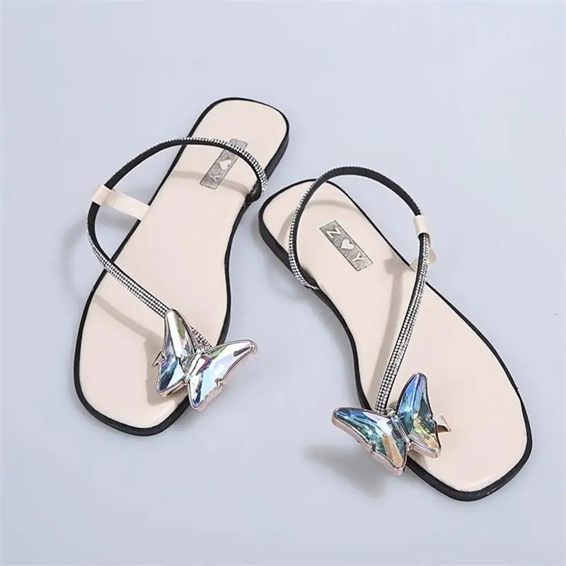 

2021 New Women's Shoes Fashion Solid Color PU Crystal Butterfly Toe Ring Flat Heel Comfortable Casual All-match Sandals KM161