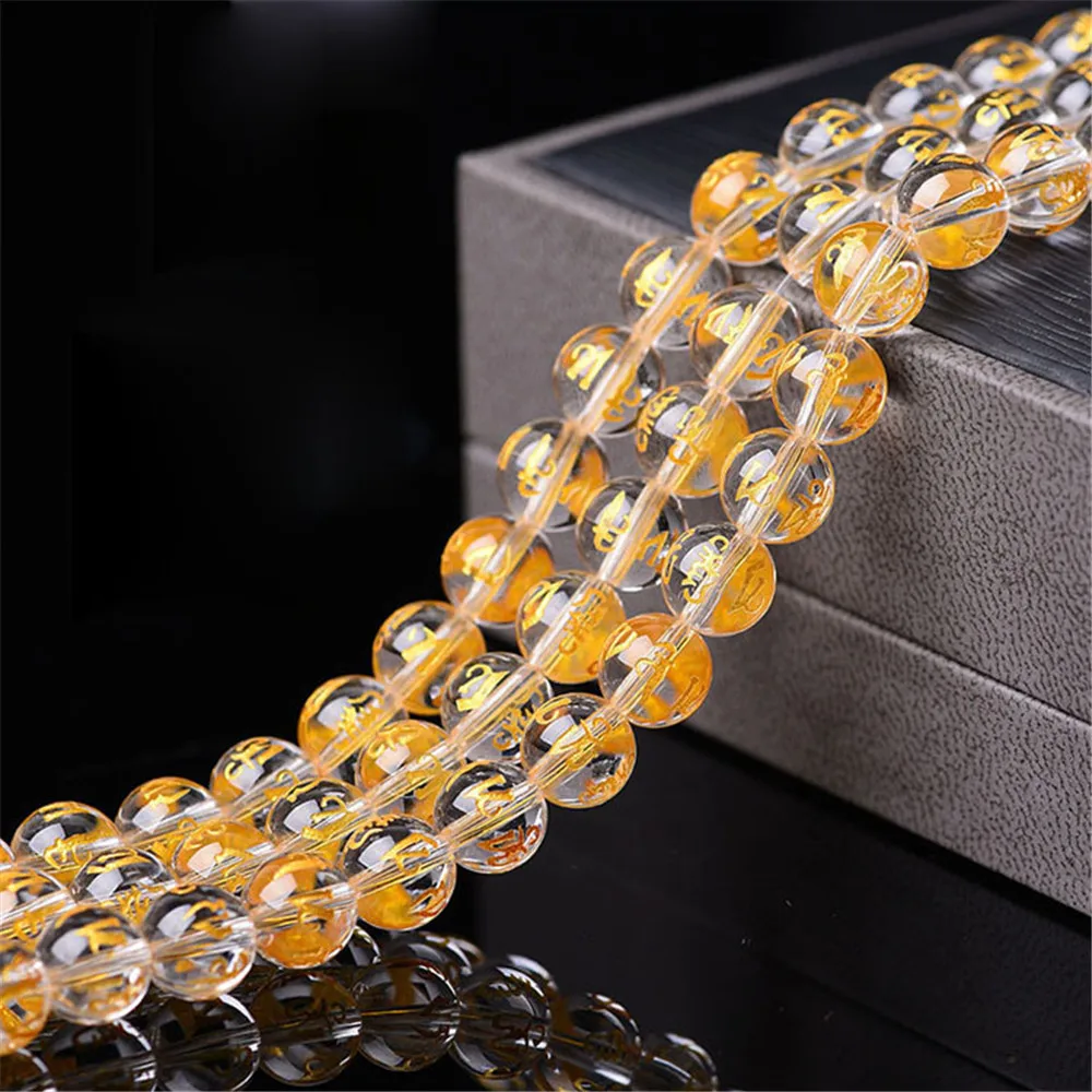 

Grade AA Natural Clear Quartz Beads with Golden Prayer Mantra Carved 6mm-14mm Smooth Polished Round 15 Inch Strand BJ12