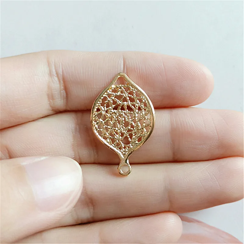 

10 pcs/lot Alloy Hollow Gold Leaves Pendant Buttons Christmas Ornaments Jewelry Earrings Choker Hair DIY Jewelry Accessories