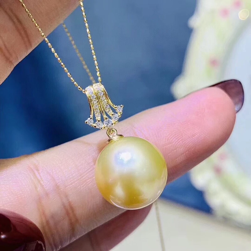 

Exquisitely Crafted 925 Silver Inlaid With Gold Pearls 11-12mm The Round Is Basically Flawless The Quality Is Very Good