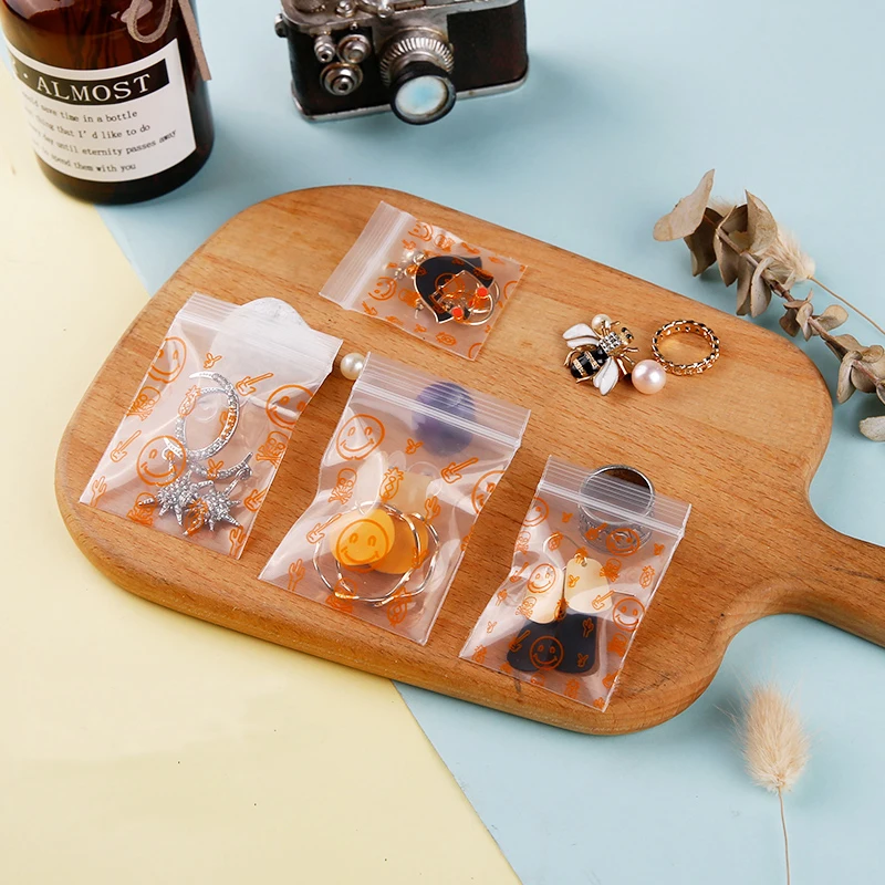 Симпатичные пластиковые пакеты на молнии с оранжевыми смайликами 100 шт.