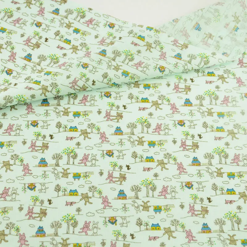 Зеленая ткань с изображением персонажей из мультфильмов и пейзажей 100% хлопковая
