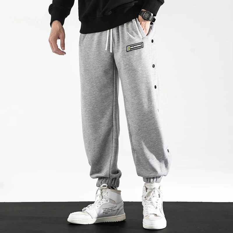 

Autumn Newly Fashion Casual Pants Men Loose Fit Side Buttons Closure Designer Basketball Trousers Hip Hop Joggers Sweatpants