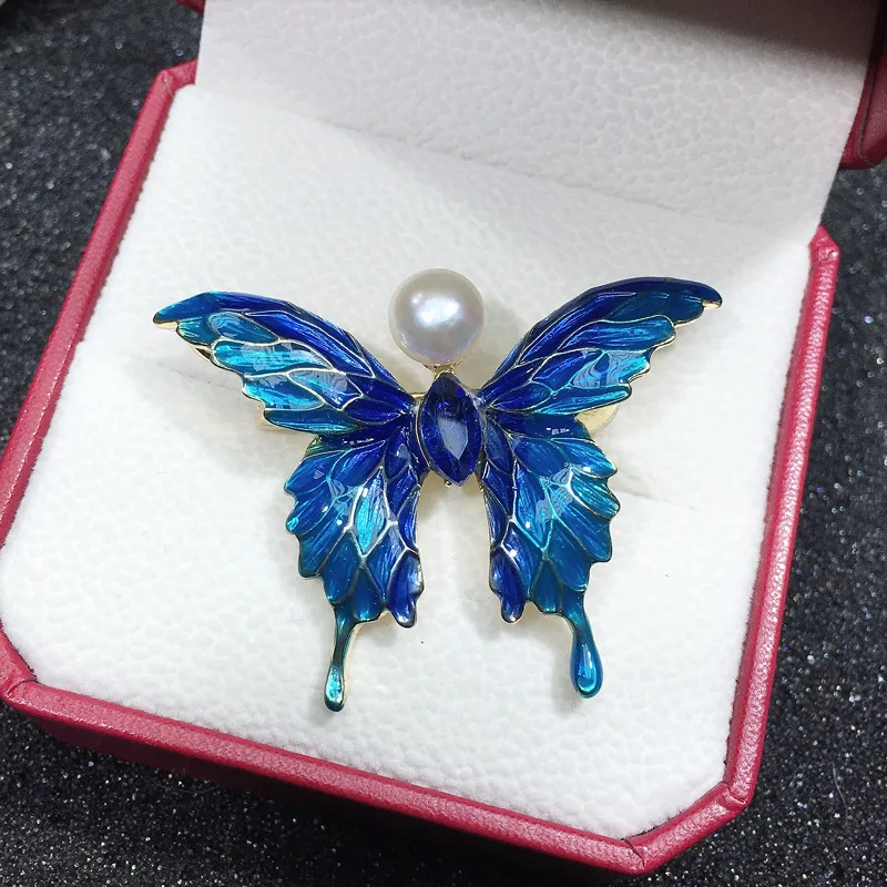 

Exquisite blue butterfly natural pearl brooch fresh water pearl lady corset gift high-grade clothes and ornaments wholesale