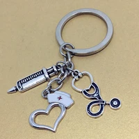 european and american fashion brand hot selling items peach heart shaped nurse cap syringe stethoscope doctors keychain