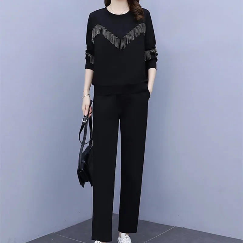 

Винтажный Повседневный свитер в стиле пэчворк с круглым вырезом и длинными рукавами с бахромой и принтом + эластичные брюки с высокой талие...