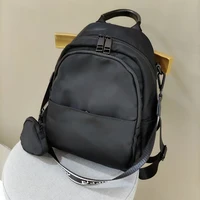 casual backpack womens light nylon backpack with one shoulder compartment and small bag pendant commuting bag