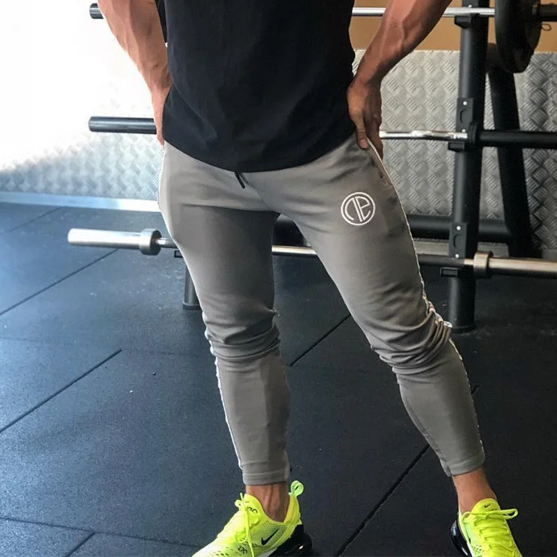 

Spring and autumn new muscle tide brand fitness pants men's cotton slim tight Leggings sports fitness clothes training pants