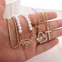 flatfoosie multi layer imitation pearls angel pendant necklace for women shiny heart cross crystal chain necklace trendy jewelry