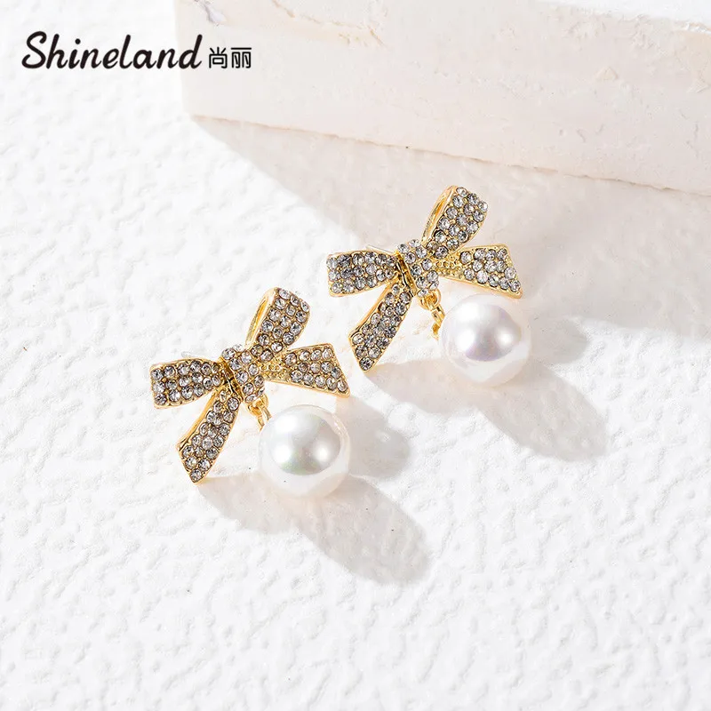 

Shineland Elegant Inlaid Zircon Bowknot Simulated Pearl Drop Dangle Earrings For Women Fashion Wedding Luxury Jewelry Best Gift