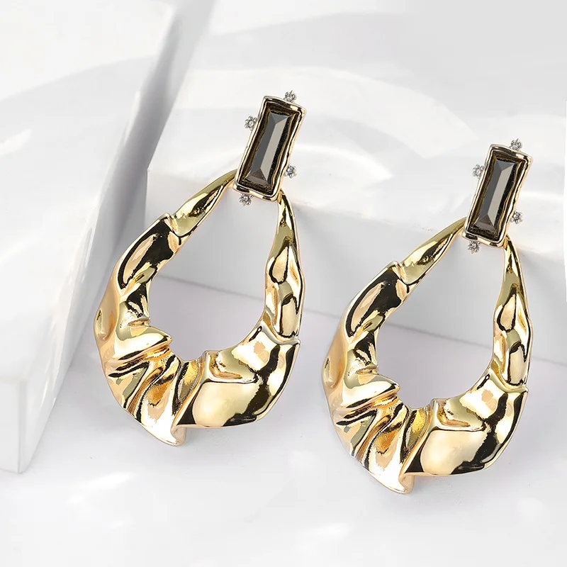 

Copper crystal stud earrings with exaggerated folds