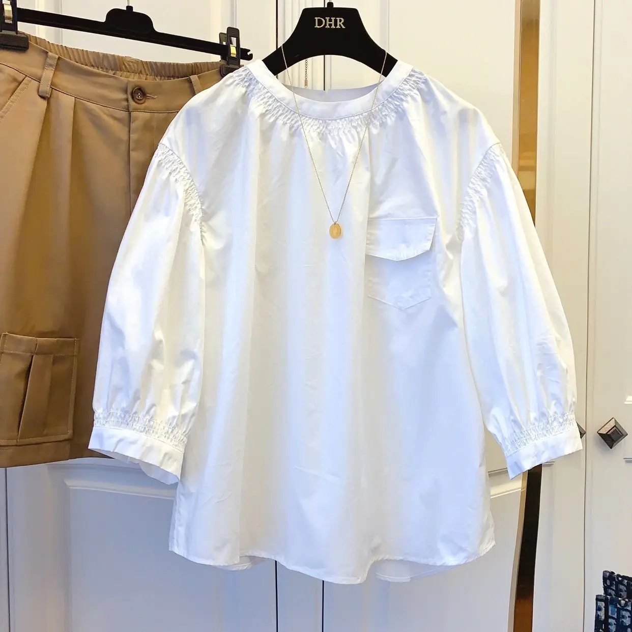

2021 spring new Korean version of loose casual niche design stitching sleeve doll shirt T-shirt jacket women