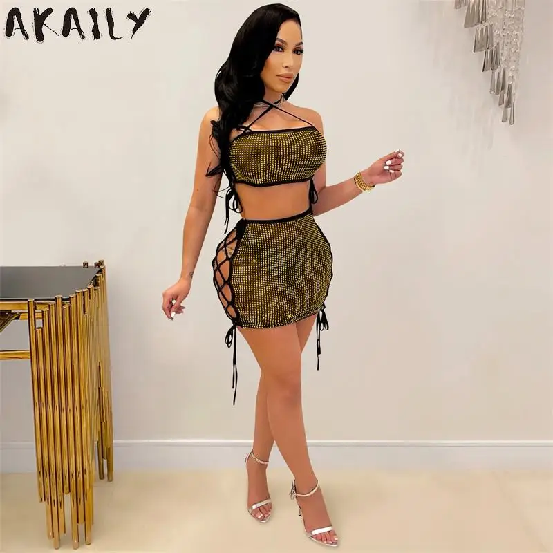 

Akaily Sexy Diamonds 2 Two Piece Skirts Sets Womens Outfits 2021 See Through Halter Bandage Crop Top And Mini Dress Sets Ladies