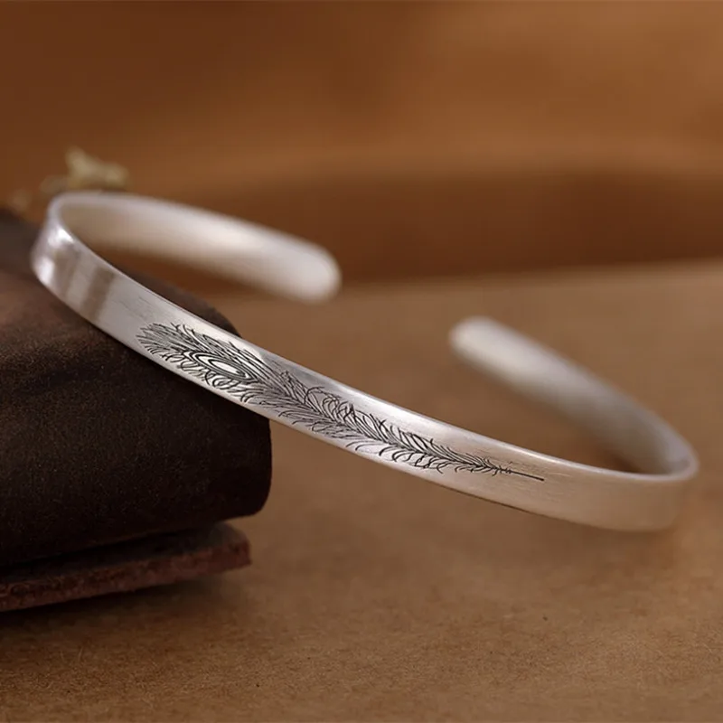 

Женский браслет из тайского серебра 999 пробы, с перьями павлина