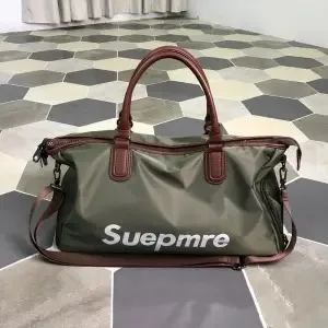 

Supreme portable travel bag men's short-distance duffel bag light and waterproof business travel bag women's fitness one-