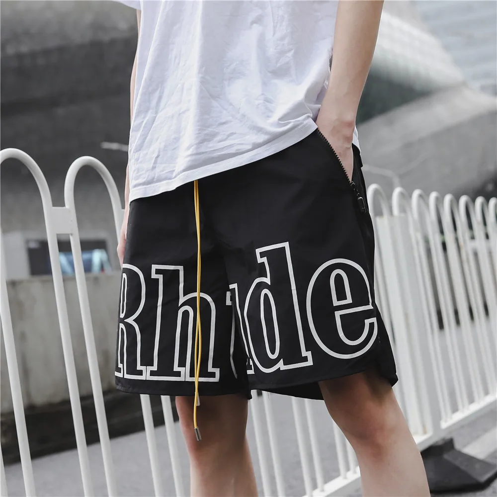 

Rhude Shorts Men Women Big Letter Logo Rhude Shorts Summer Casual Oversize Breechcloth Yellow drawstring Pill Zipper Head