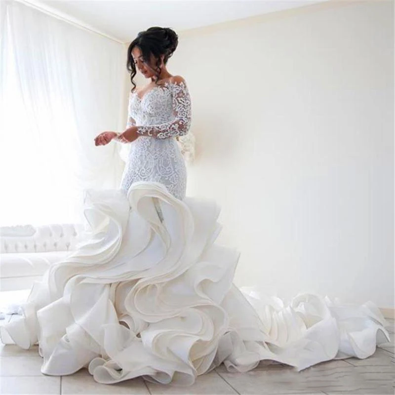 

2020 Elegant Mermaid Wedding Dresses Lace Applique Sheer Jewel Neck Long Sleeves Ruffles Tiered Skirts Chapel Train Button Back