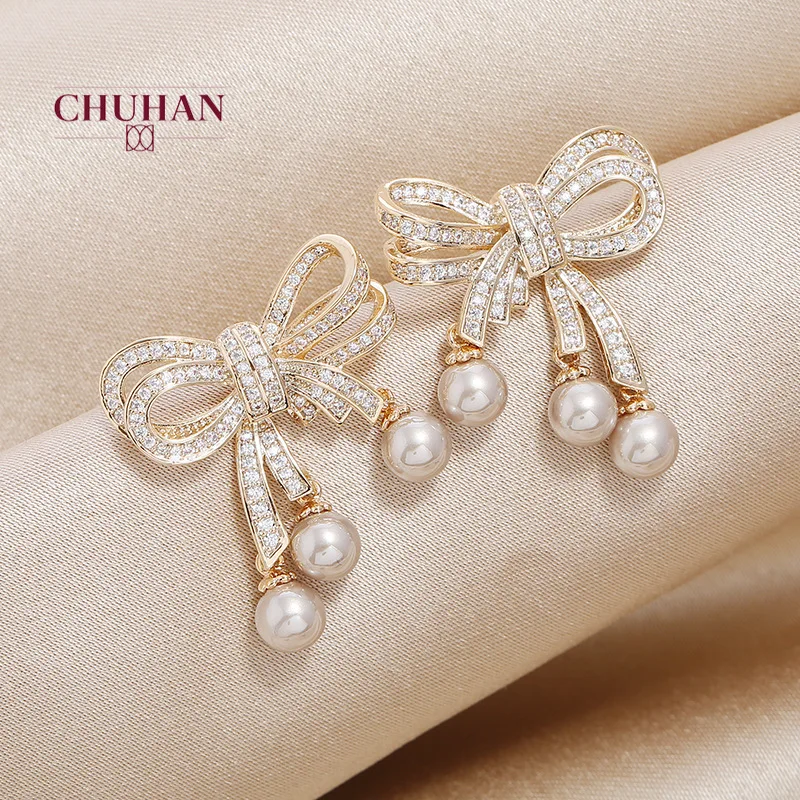 Женские серьги-гвоздики в виде банта золотого и серебряного цвета | Украшения